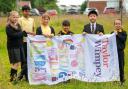 The children from Primary 5 at St Mark’s Primary in Barrhead with the 
winning flag for Taylor Wimpey West Scotland’s Springhill Gardens development.