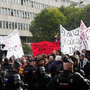 Protesters face police as they gather against poor education school conditions in Paris on Thursday (Teresa Suarez/AP)